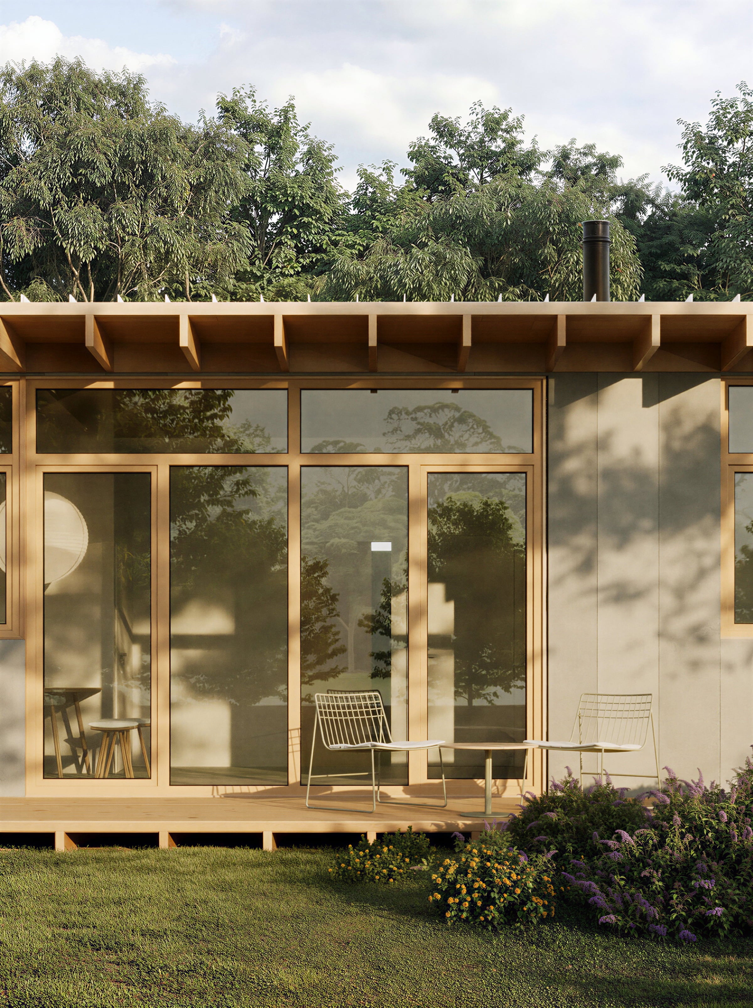 Modern wooden house with large glass windows in a green, tree-filled landscape.
