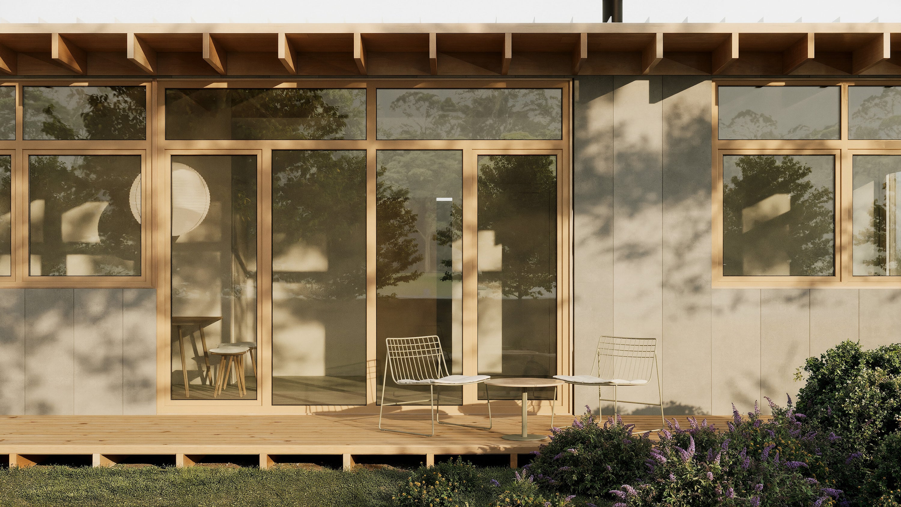 Modern house exterior with large glass windows and a wooden deck.